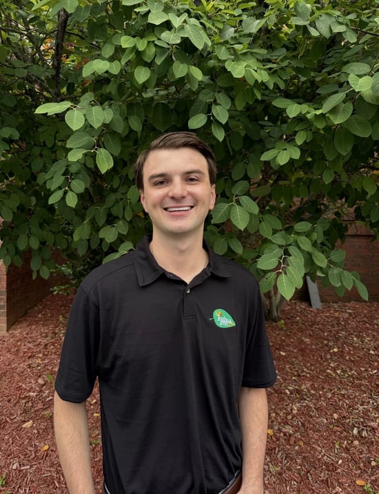 Northeast Atlanta, GA JTE owner standing infront of greenery