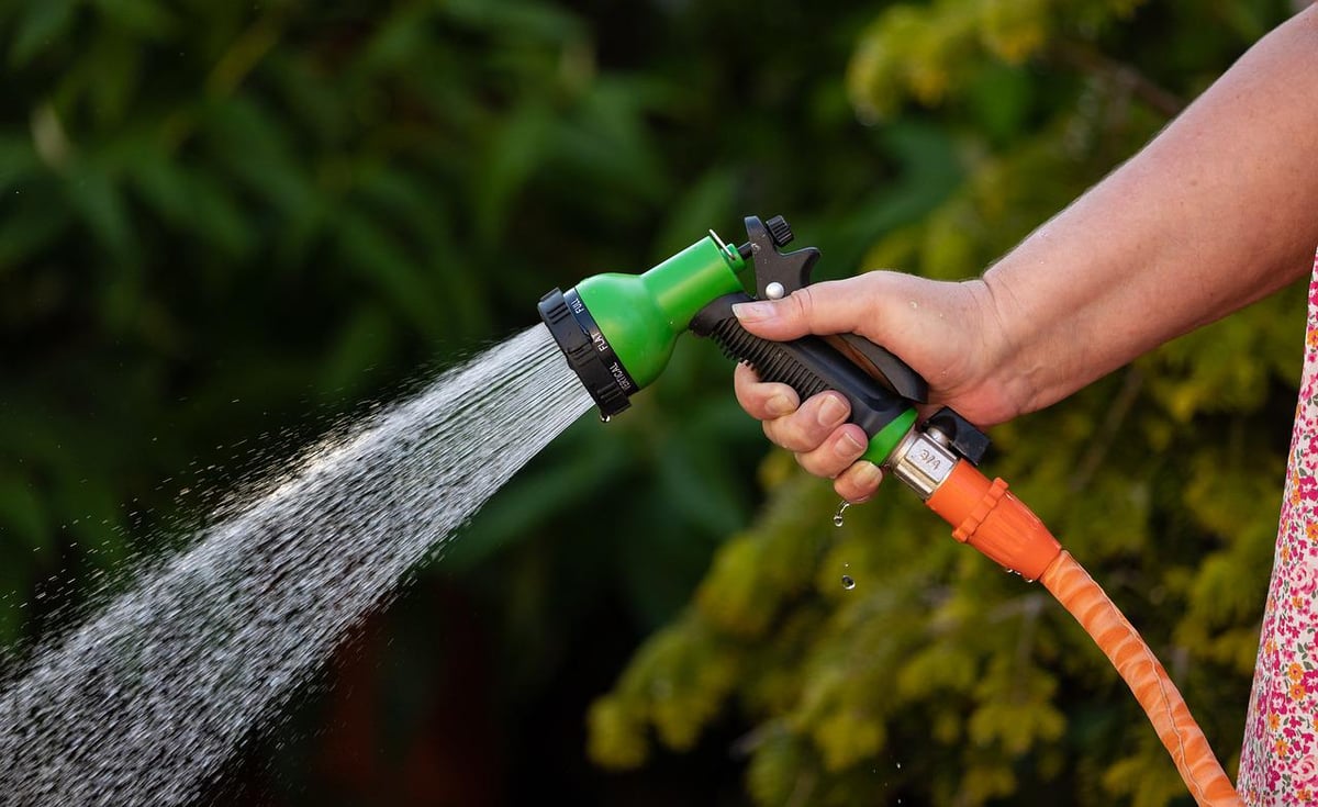 garden hose with water spraying out