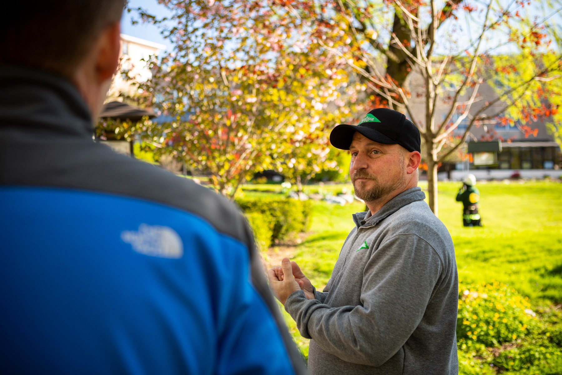 customer and lawn care expert meet 