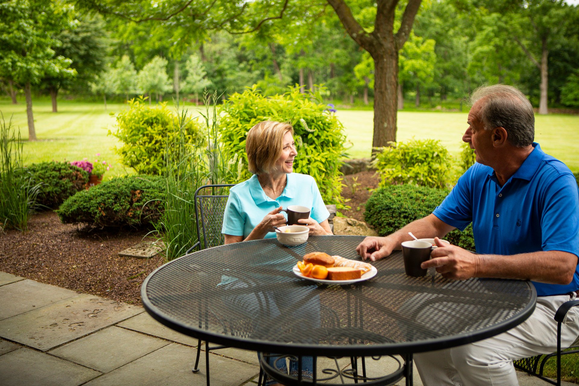 neighbors discussing lawn care