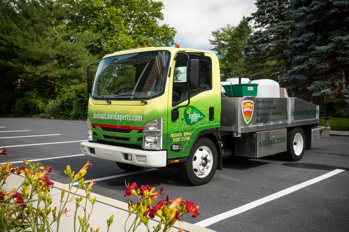 pest control truck parks in parking lot