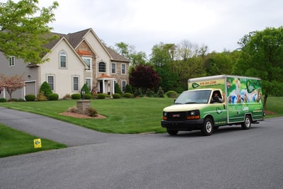 Joshua Tree Lawn Care truck in front of nice lawn