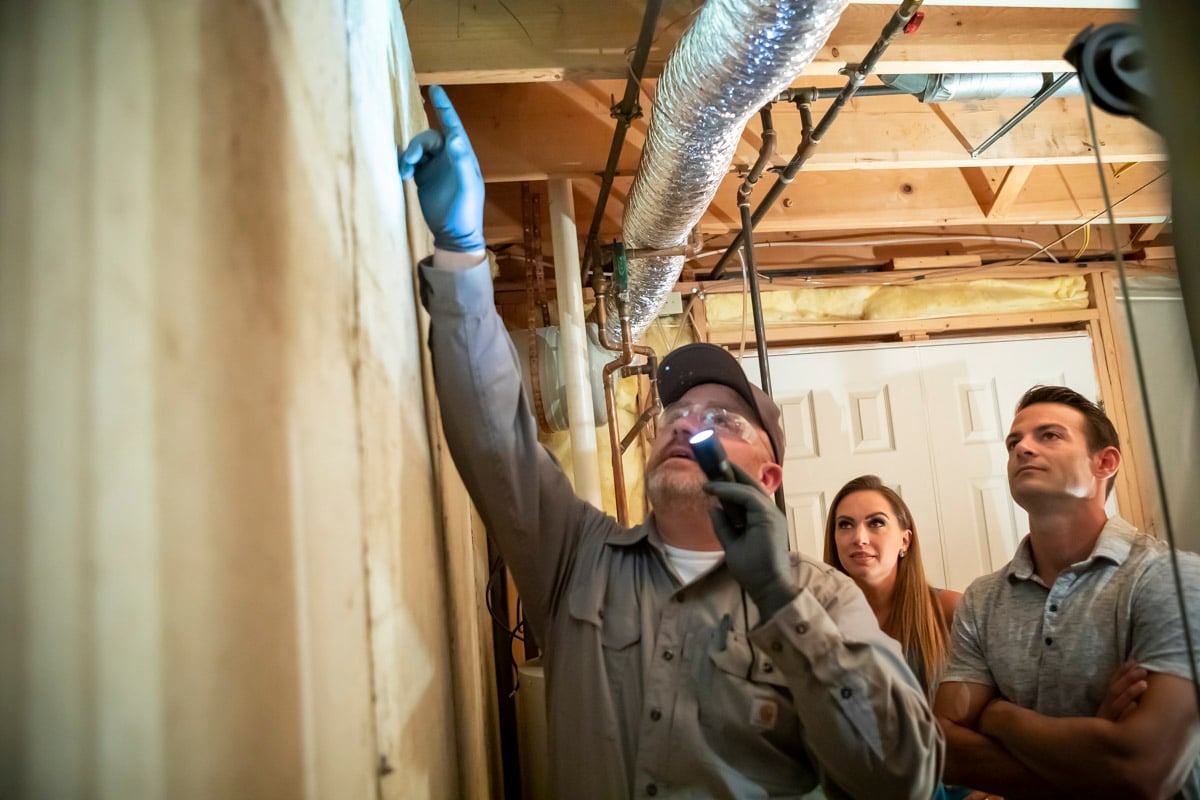 technician pest control inspection for cockroaches in house