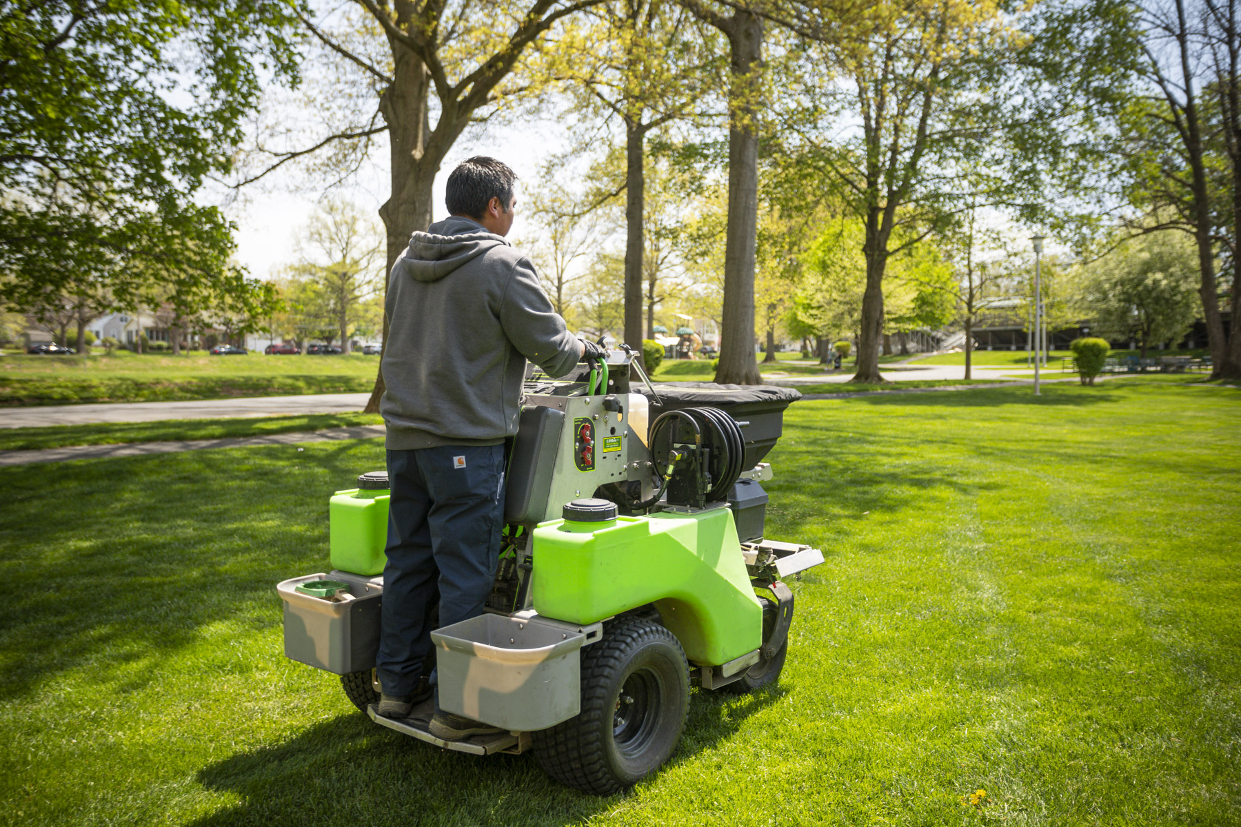 Lawn care service treating lawn