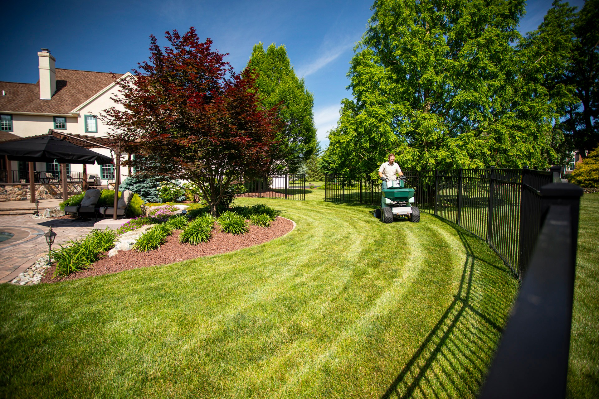 Lawn care technician caring for lawn in Easton, PA